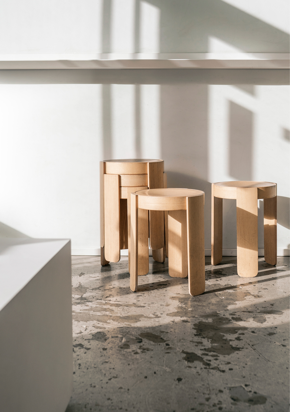 stack of stools in the sun at Tornqvist Coffee Hamburg designed by AENY